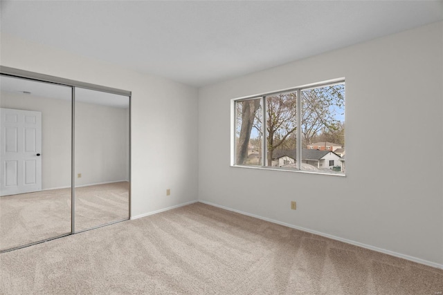 7 Beavertail Ct, Florissant, MO 63033 - unfurnished bedroom with carpet flooring, a closet, and baseboards