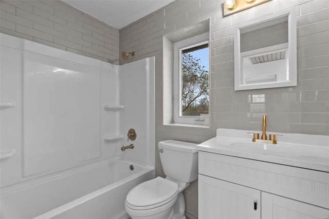 7 Beavertail Ct, Florissant, MO 63033 - bathroom featuring tile walls, toilet, vanity, and shower / bath combination