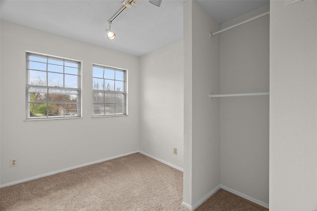 7 Beavertail Ct, Florissant, MO 63033 - carpeted spare room with baseboards and track lighting