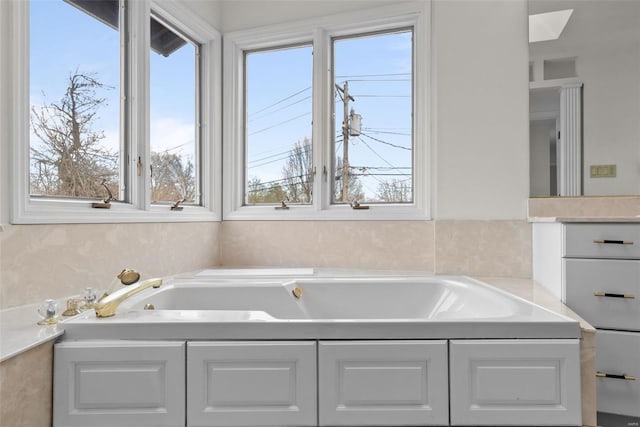 7 Beavertail Ct, Florissant, MO 63033 - bathroom with healthy amount of natural light and a garden tub