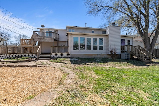 7 Beavertail Ct, Florissant, MO 63033 - rear view of house with a chimney, a wooden deck, a lawn, and central AC unit