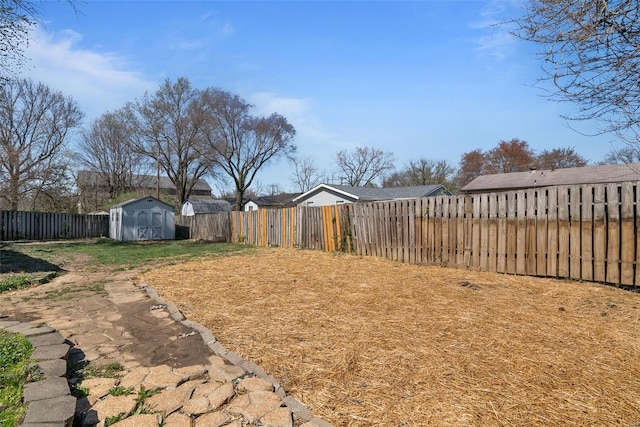 7 Beavertail Ct, Florissant, MO 63033 - fenced backyard with a storage shed and an outbuilding