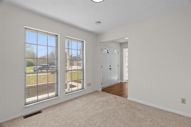 7 Beavertail Ct, Florissant, MO 63033 - empty room with carpet flooring and baseboards