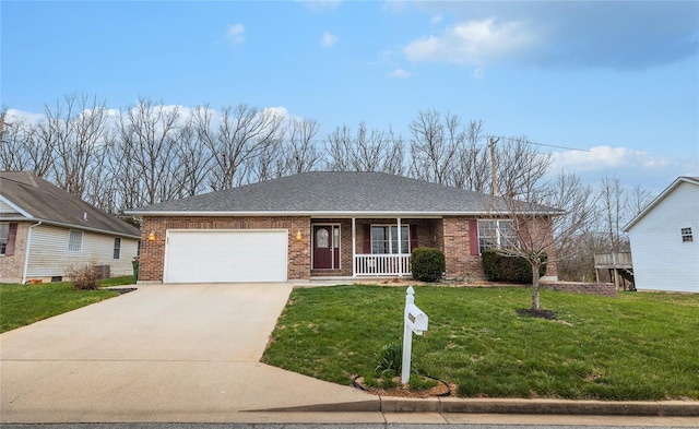 1205 Britt Ln, Rolla, MO 65401 - ranch-style home featuring brick siding, driveway, an attached garage, covered porch, and a front yard