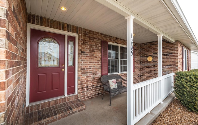 1205 Britt Ln, Rolla, MO 65401 - entrance to property featuring covered porch and brick siding