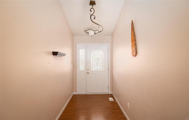 1205 Britt Ln, Rolla, MO 65401 - doorway to outside with baseboards and dark wood-style floors