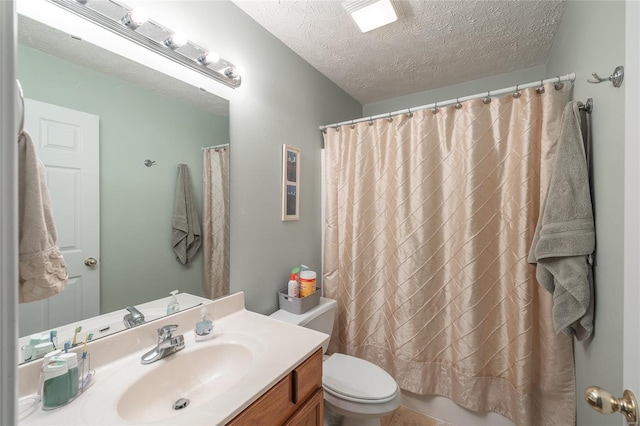 1205 Britt Ln, Rolla, MO 65401 - full bathroom featuring a textured ceiling, toilet, and vanity