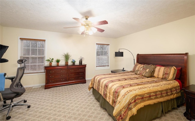 1205 Britt Ln, Rolla, MO 65401 - carpeted bedroom featuring baseboards, ceiling fan, a textured ceiling, and an office area