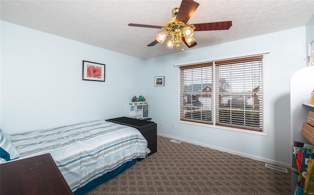 1205 Britt Ln, Rolla, MO 65401 - bedroom featuring a textured ceiling, carpet floors, baseboards, and a ceiling fan