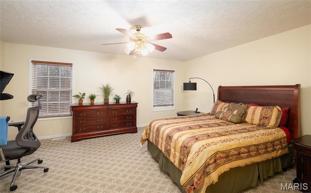 1205 Britt Ln, Rolla, MO 65401 - carpeted bedroom featuring a ceiling fan, a textured ceiling, and an office area