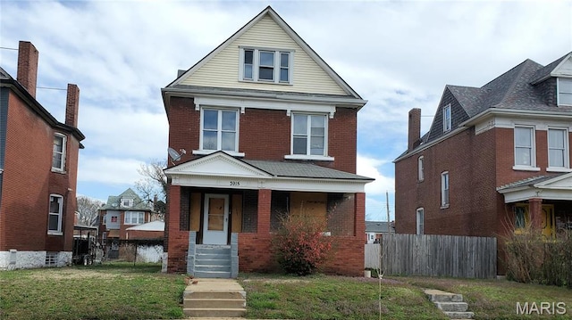traditional style home with brick siding and a porch
