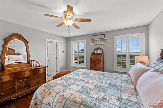 bedroom with dark wood finished floors and a ceiling fan