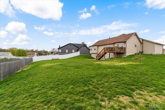 view of yard with stairway and a deck
