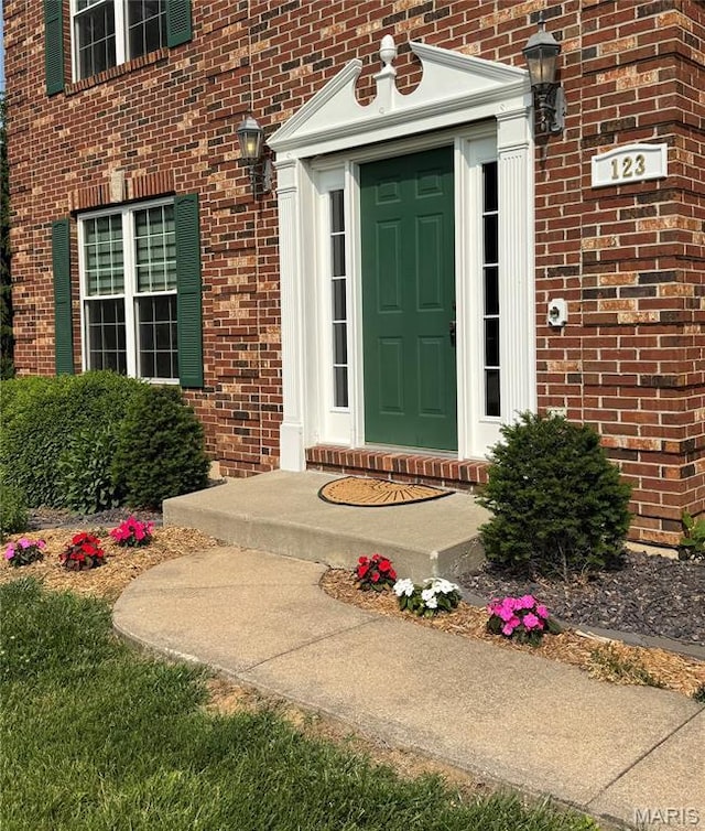 123 El Rancho Dr, Hannibal, MO 63401 - view of exterior entry featuring brick siding
