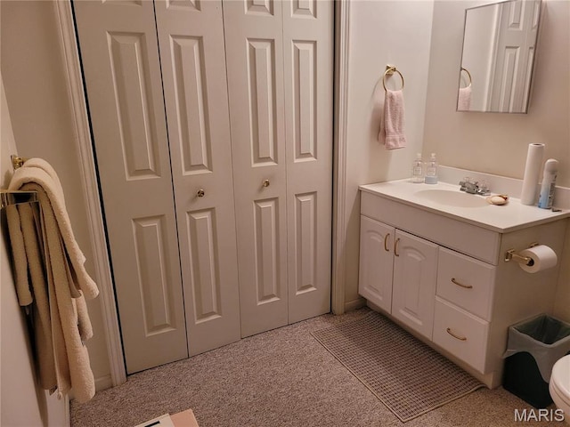 123 El Rancho Dr, Hannibal, MO 63401 - bathroom featuring a closet, vanity, and toilet