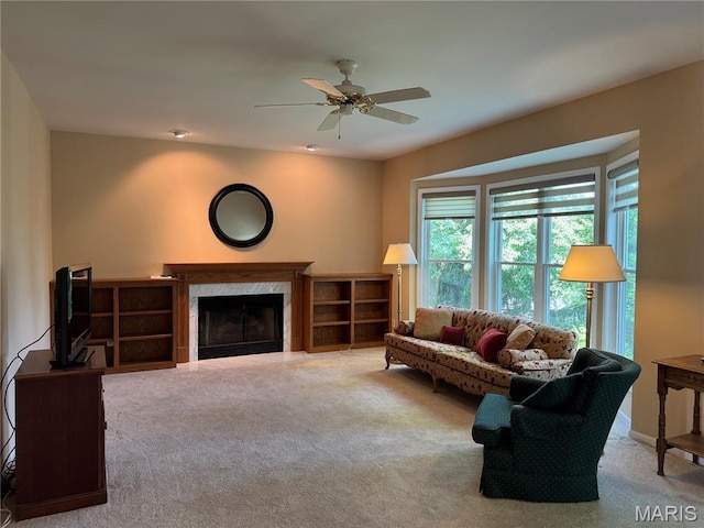 123 El Rancho Dr, Hannibal, MO 63401 - living area featuring carpet, a high end fireplace, and a ceiling fan