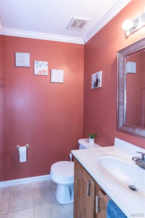 bathroom featuring crown molding, toilet, vanity, and baseboards