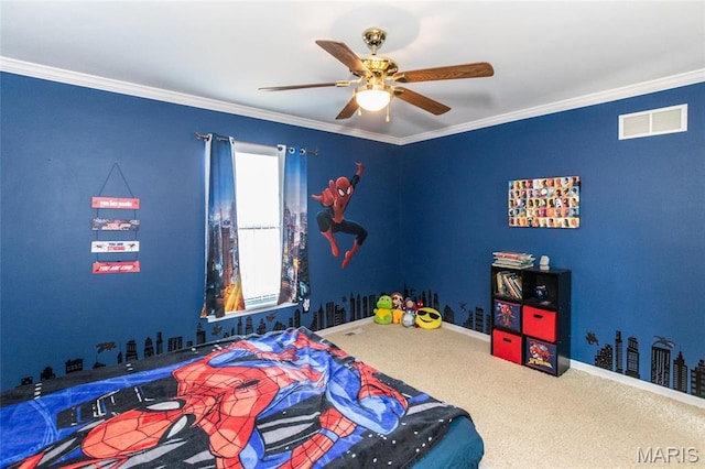 carpeted bedroom with a ceiling fan, baseboards, and crown molding