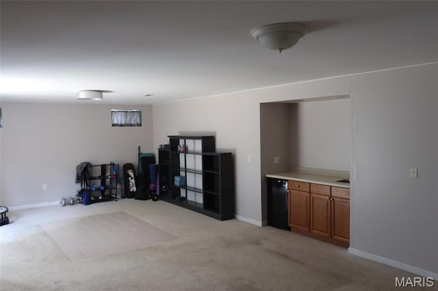 9 Shelby Crest Ct, Ofallon, MO 63366 - finished basement with light colored carpet and fridge