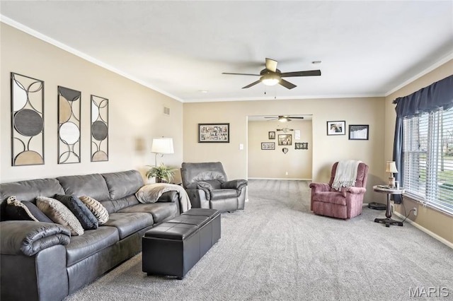 living area featuring ceiling fan, crown molding, carpet flooring, and baseboards