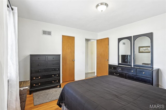 bedroom with wood finished floors