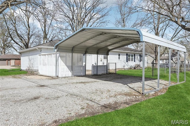 view of parking / parking lot with a carport and driveway