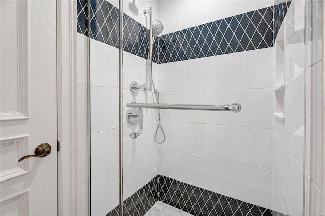 full bath featuring a shower stall