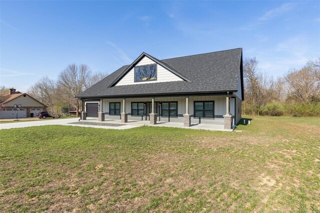 213 Lakeview Dr, Farmington, MO 63640 - view of front facade featuring covered porch, driveway, a shingled roof, and a front lawn