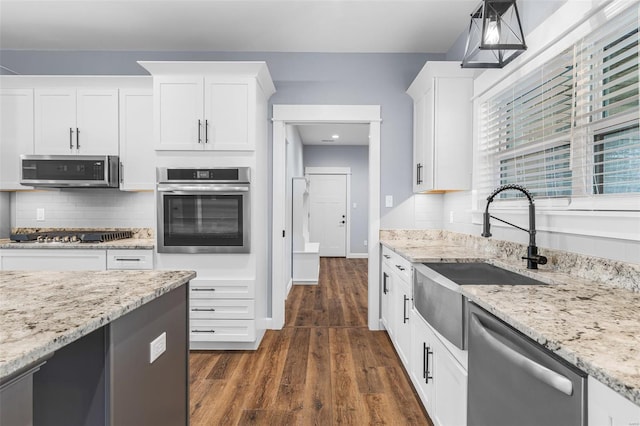 213 Lakeview Dr, Farmington, MO 63640 - kitchen with stainless steel appliances, a sink, white cabinets, and dark wood finished floors