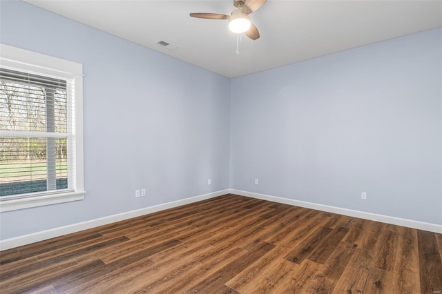 213 Lakeview Dr, Farmington, MO 63640 - spare room with baseboards, dark wood-type flooring, and ceiling fan