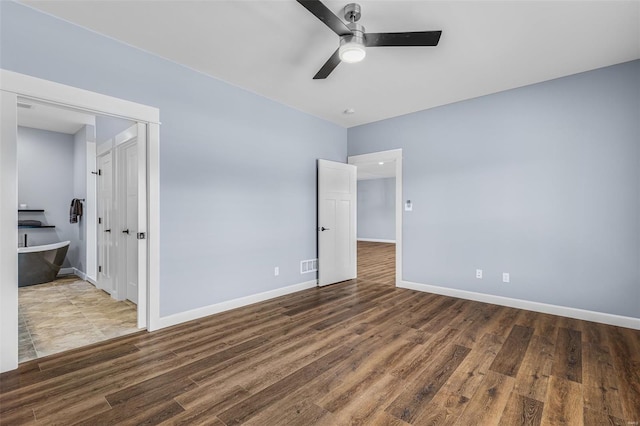 213 Lakeview Dr, Farmington, MO 63640 - unfurnished bedroom with baseboards, wood finished floors, a ceiling fan, and a closet