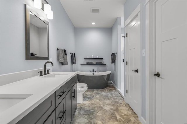213 Lakeview Dr, Farmington, MO 63640 - full bath featuring a freestanding tub, double vanity, baseboards, and toilet