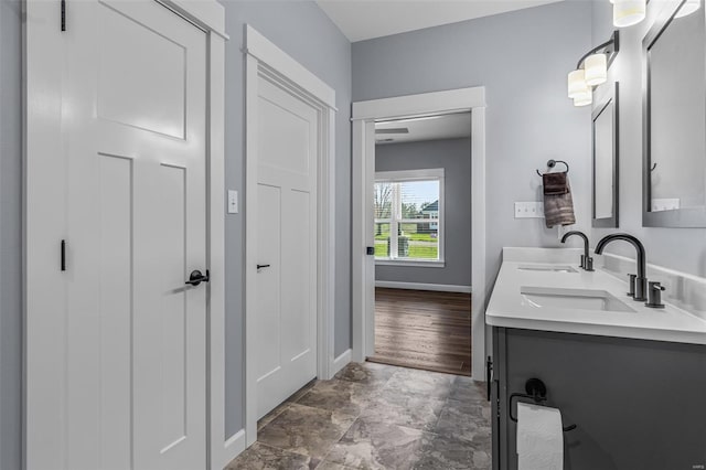 213 Lakeview Dr, Farmington, MO 63640 - full bathroom featuring double vanity, baseboards, and stone finish floors