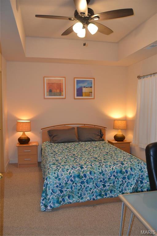 bedroom with carpet floors and a ceiling fan