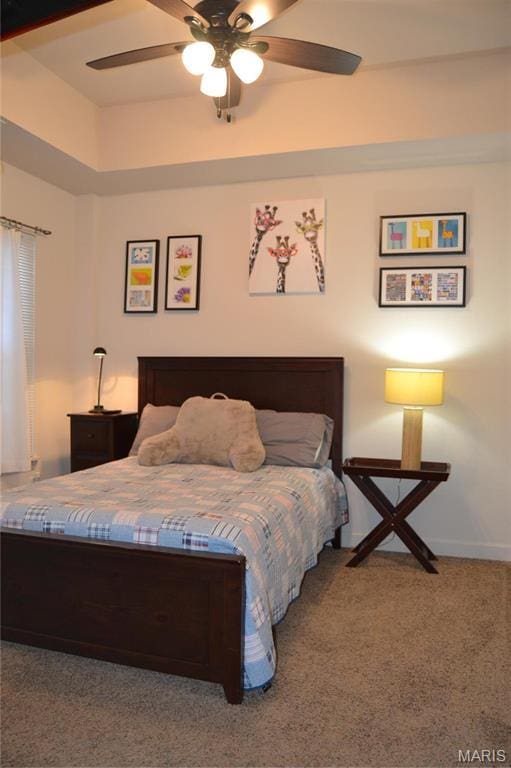 bedroom with carpet floors, ceiling fan, and baseboards