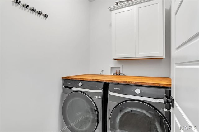 1154 Bloomfield Dr, Eureka, MO 63025 - laundry room with washing machine and dryer, cabinet space, and bar area