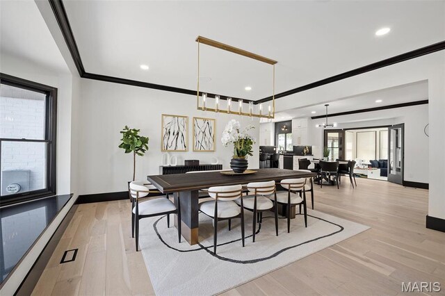 13516 Weston Park Dr, Saint Louis, MO 63131 - dining space featuring ornamental molding, baseboards, light wood-style floors, and recessed lighting