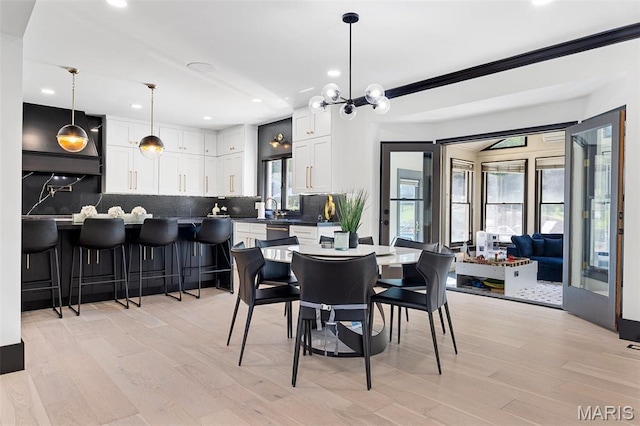 13516 Weston Park Dr, Saint Louis, MO 63131 - dining room featuring recessed lighting, light wood-style floors, and a chandelier