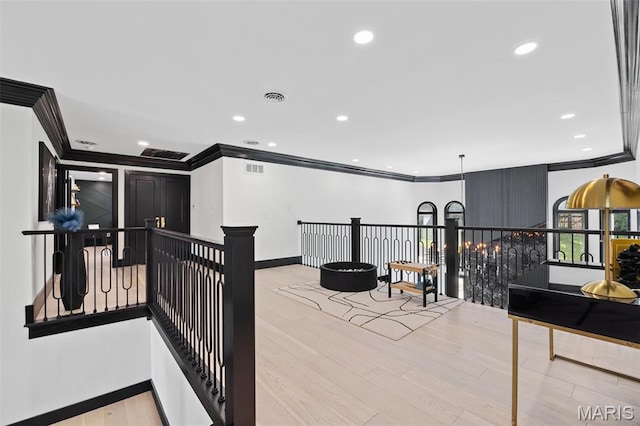 13516 Weston Park Dr, Saint Louis, MO 63131 - corridor featuring ornamental molding, wood finished floors, an upstairs landing, baseboards, and recessed lighting