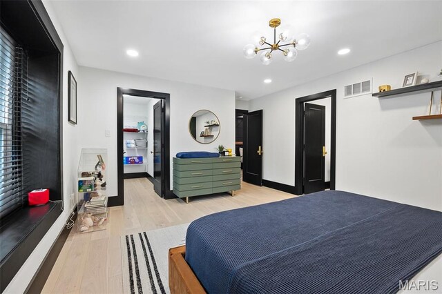 13516 Weston Park Dr, Saint Louis, MO 63131 - bedroom featuring light wood finished floors, a chandelier, and recessed lighting