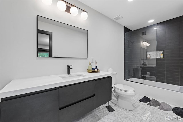 13516 Weston Park Dr, Saint Louis, MO 63131 - bathroom with toilet, vanity, combined bath / shower with glass door, recessed lighting, and tile patterned flooring