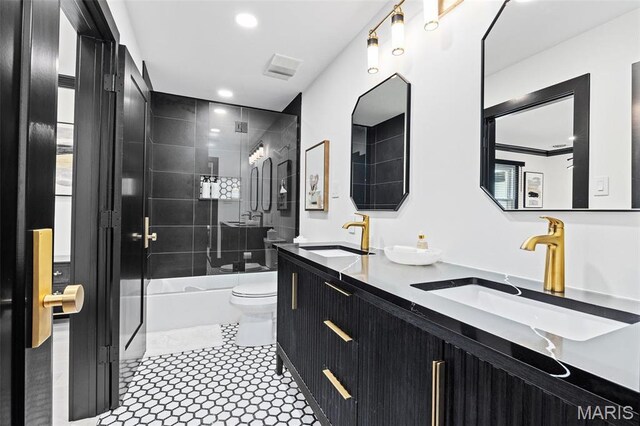 13516 Weston Park Dr, Saint Louis, MO 63131 - bathroom with toilet, bathing tub / shower combination, double vanity, and recessed lighting