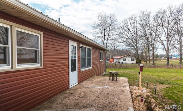 4434 County Road 4110, Salem, MO 65560 - view of side of home featuring a lawn and a patio
