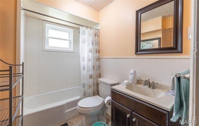 4434 County Road 4110, Salem, MO 65560 - bathroom featuring tile walls, shower / tub combo, toilet, vanity, and a wainscoted wall