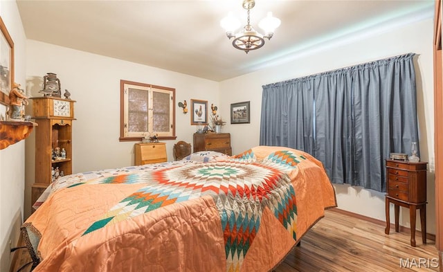4434 County Road 4110, Salem, MO 65560 - bedroom featuring wood finished floors and a chandelier