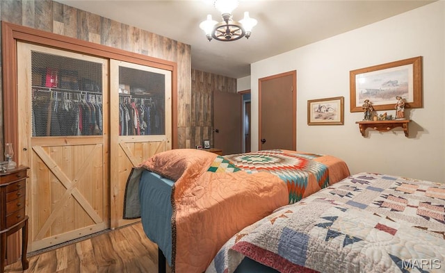 4434 County Road 4110, Salem, MO 65560 - bedroom featuring wood finished floors and a chandelier