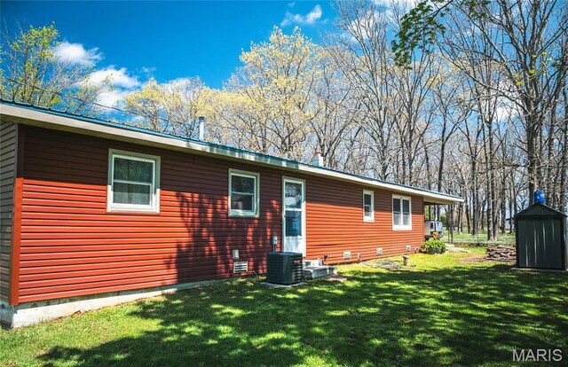 4434 County Road 4110, Salem, MO 65560 - rear view of house with a storage shed, a lawn, an outbuilding, and cooling unit