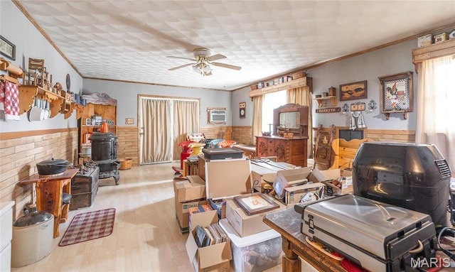 4434 County Road 4110, Salem, MO 65560 - interior space featuring a wainscoted wall, ceiling fan, ornamental molding, wood finished floors, and a wall mounted air conditioner
