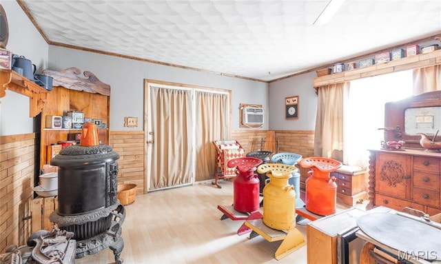 4434 County Road 4110, Salem, MO 65560 - interior space featuring a wainscoted wall, wood finished floors, ornamental molding, and an AC wall unit