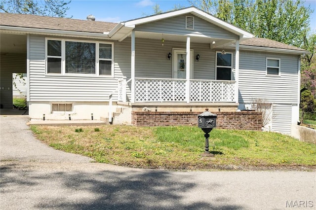 2820 Vista Ln, Cape Girardeau, MO 63701 - view of front of property featuring a porch, a shingled roof, and a carport